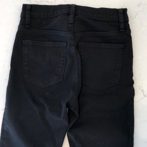 J.Crew 10” High Rise Toothpick Jean in black.